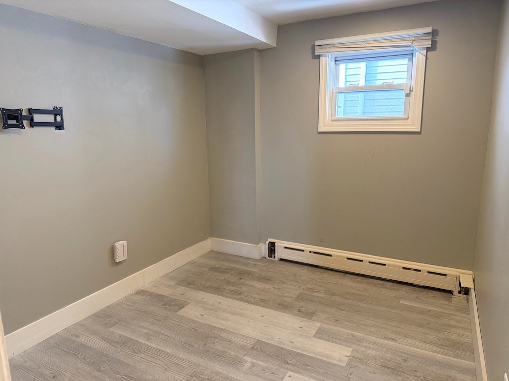 493 Rivet Street New Bedford, MA 02740 - Photo 12 of 20 an empty room with a window
