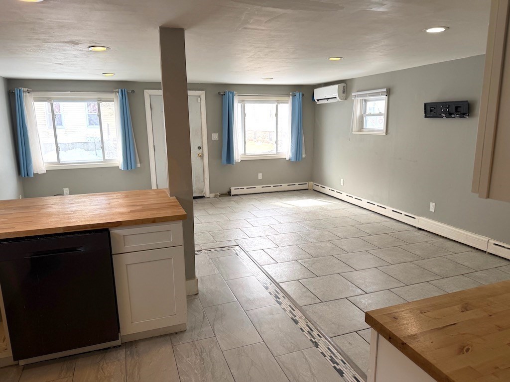 493 Rivet Street New Bedford, MA 02740 - Photo 6 of 20 a view of kitchen with granite countertop cabinets and window