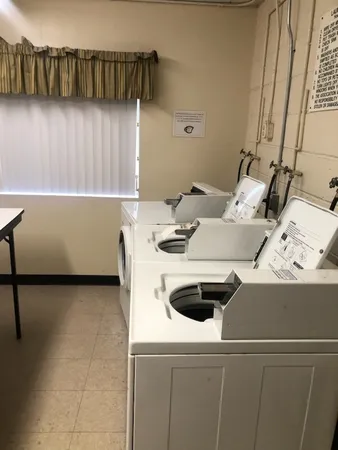 a kitchen with a sink and a stove top oven
