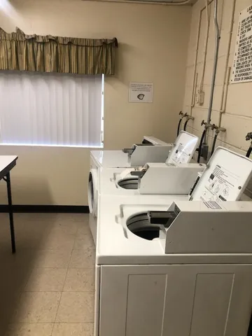 a kitchen with a sink and a stove top oven