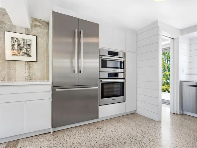 a view of a garden with a building in the background