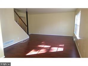 211 A Willow Turn, Unit 2 Mount Laurel, NJ 08054 - Photo 2 of 8 a black and white photo of a living room