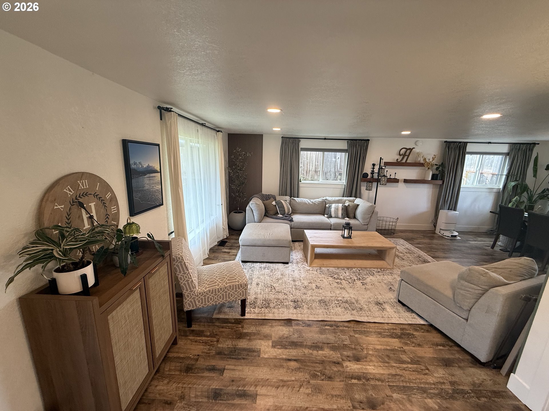 6974 Glacier Drive Springfield, OR 97478 - Photo 8 of 37 a living room with furniture a couch and a stove