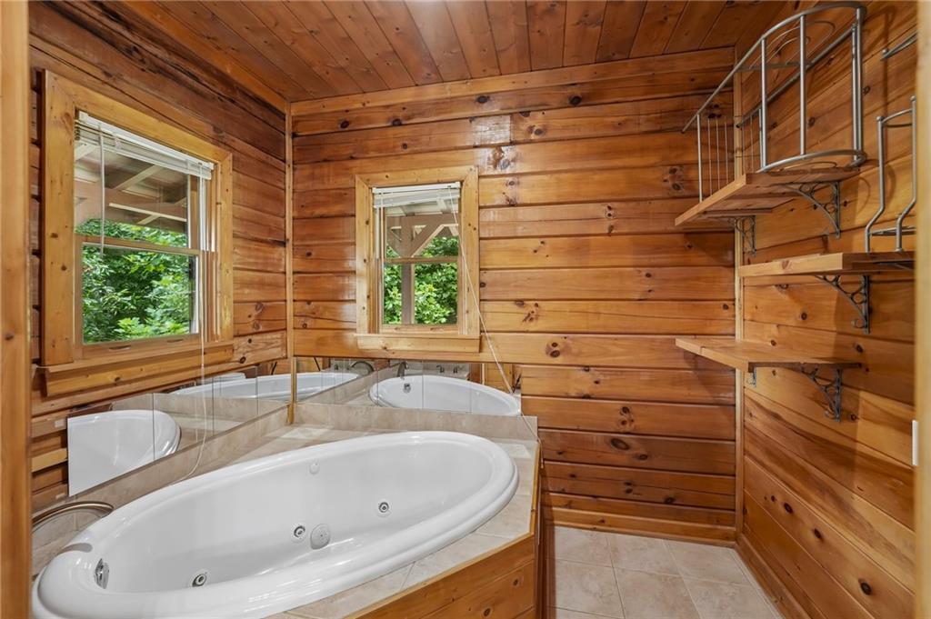 1384 Crystal Lane Northeast Ranger, GA 30734 - Photo 22 of 89 a bathroom with a bathtub and window