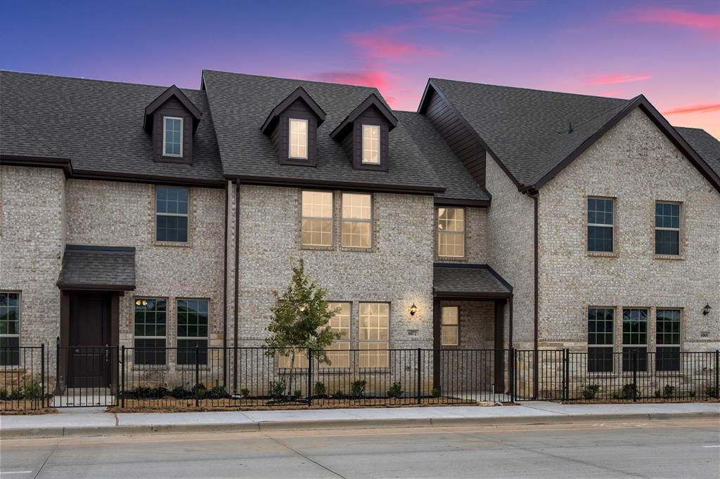 6072 Bursey Road Watauga, TX 76148 - Photo 1 of 1 Multi unit property with a fenced front yard, roof with shingles, and brick siding