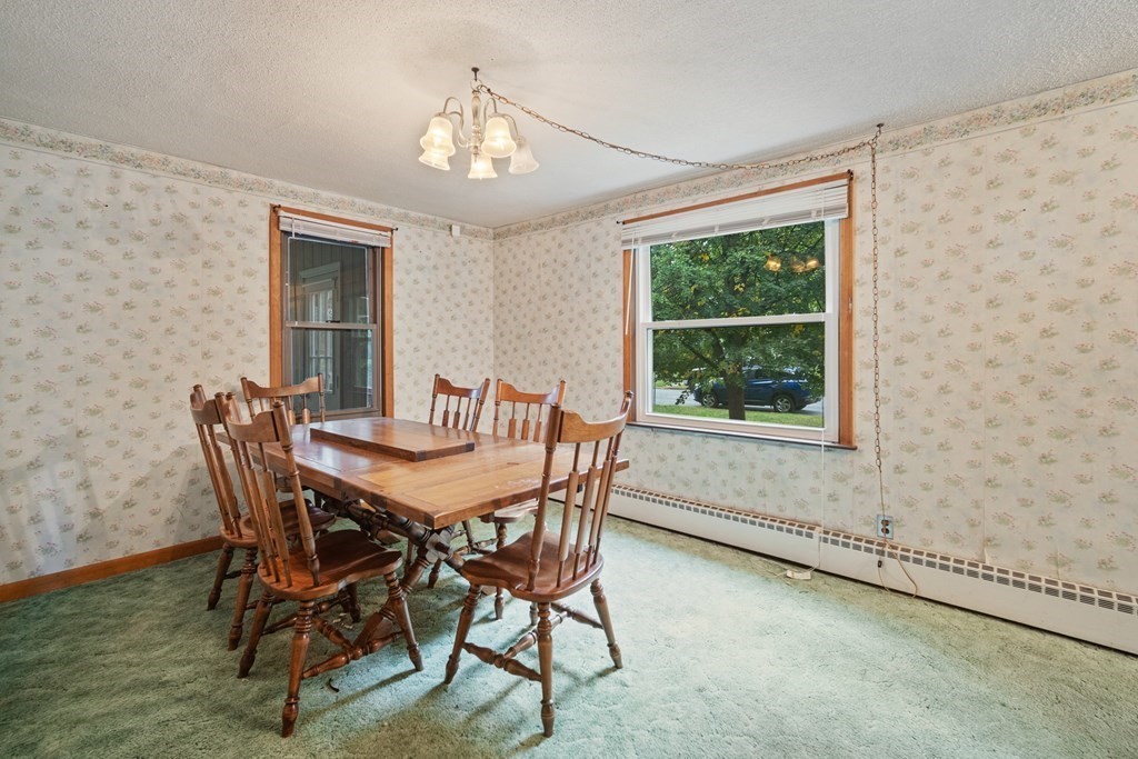 90 Oxford Road Holyoke, MA 01040 - Photo 11 of 29 a view of a dining room with furniture window and outside view