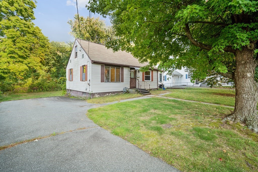 90 Oxford Road Holyoke, MA 01040 - Photo 3 of 29 a front view of a house with yard and green space