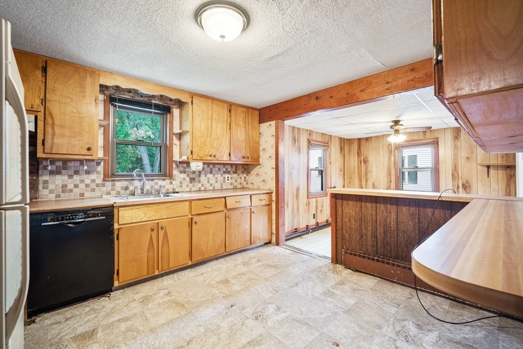 90 Oxford Road Holyoke, MA 01040 - Photo 5 of 29 a spacious bathroom with a granite countertop sink mirror and a bathtub