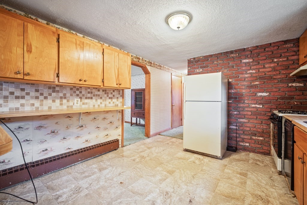 90 Oxford Road Holyoke, MA 01040 - Photo 7 of 29 a view of kitchen with refrigerator sink and cabinets