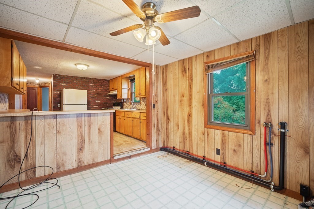 90 Oxford Road Holyoke, MA 01040 - Photo 8 of 29 a view of a kitchen with furniture and a window