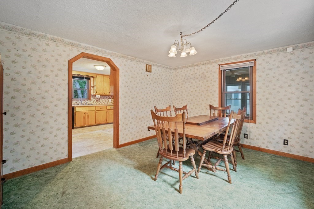 90 Oxford Road Holyoke, MA 01040 - Photo 10 of 29 a view of a dining room with furniture and a chandelier