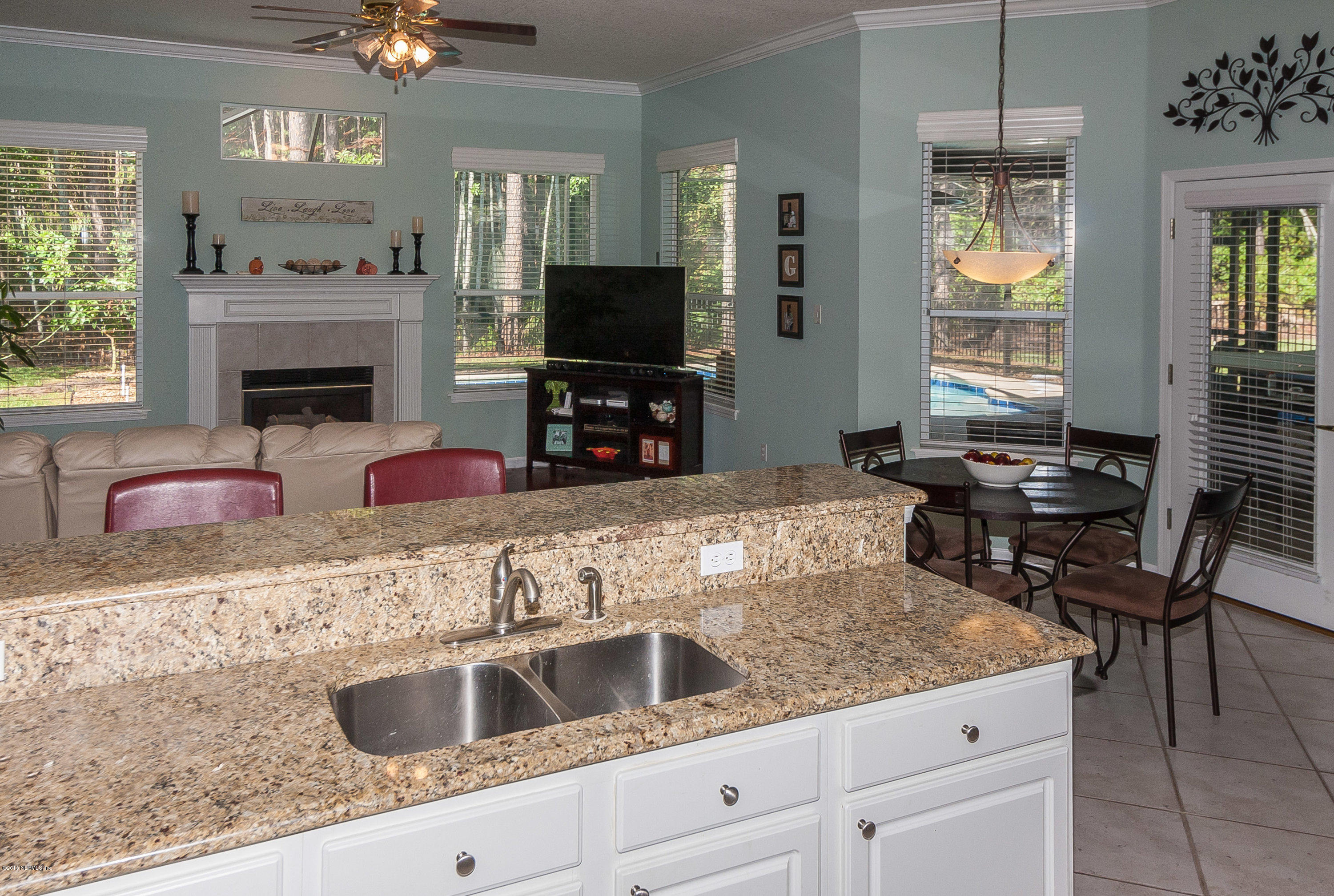 9116 Timberlin Lake Road Jacksonville, FL 32256 - Photo 9 of 26 Kitchen opens to family room