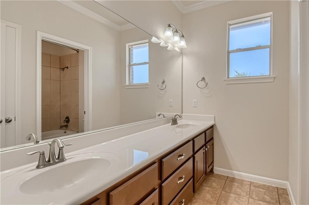 3822 Remington Road Cedar Park, TX 78613 - Photo 21 of 31 a bathroom with a sink and a mirror