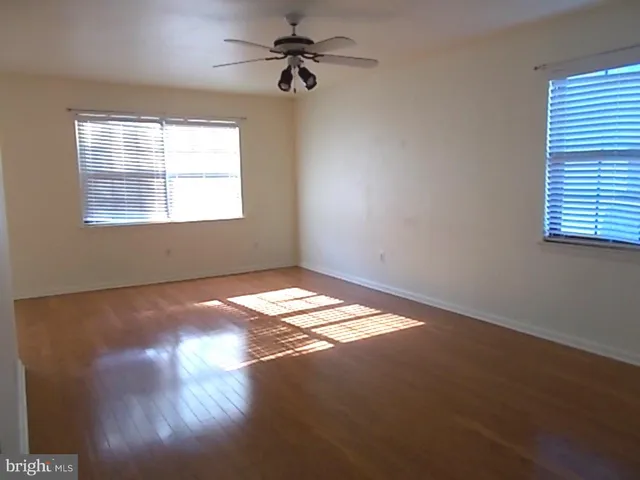 a view of empty room with windows