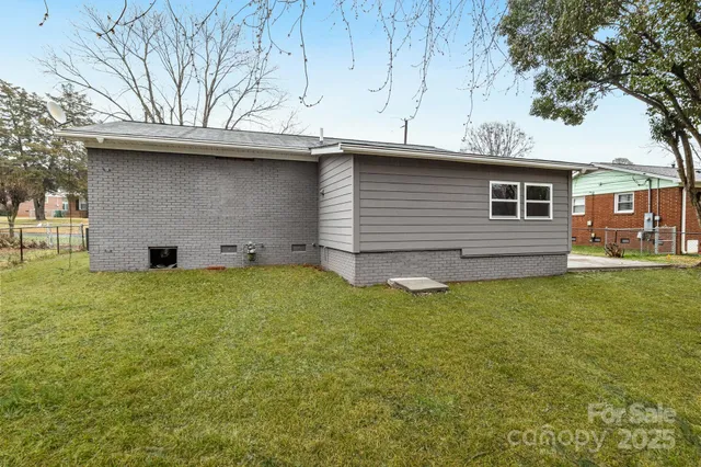 a backyard of a house with lots of green space