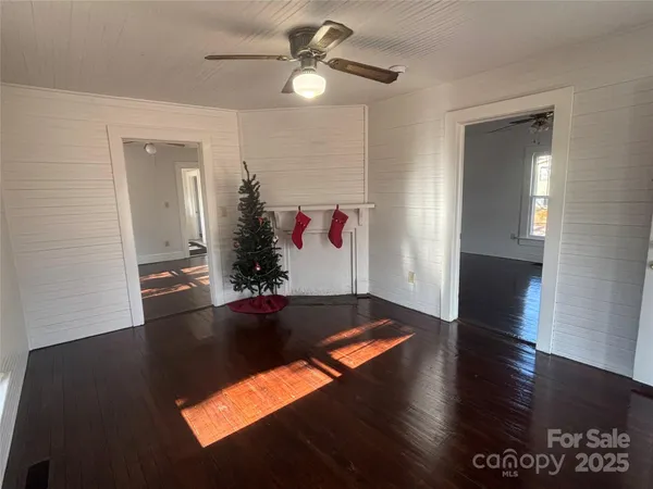 a living room with hard wood flooring