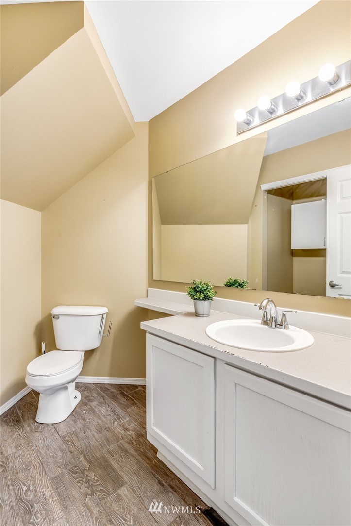 13402 Prospector Ridge Road Southeast Monroe, WA 98272 - Photo 14 of 30 a bathroom with a toilet sink and mirror