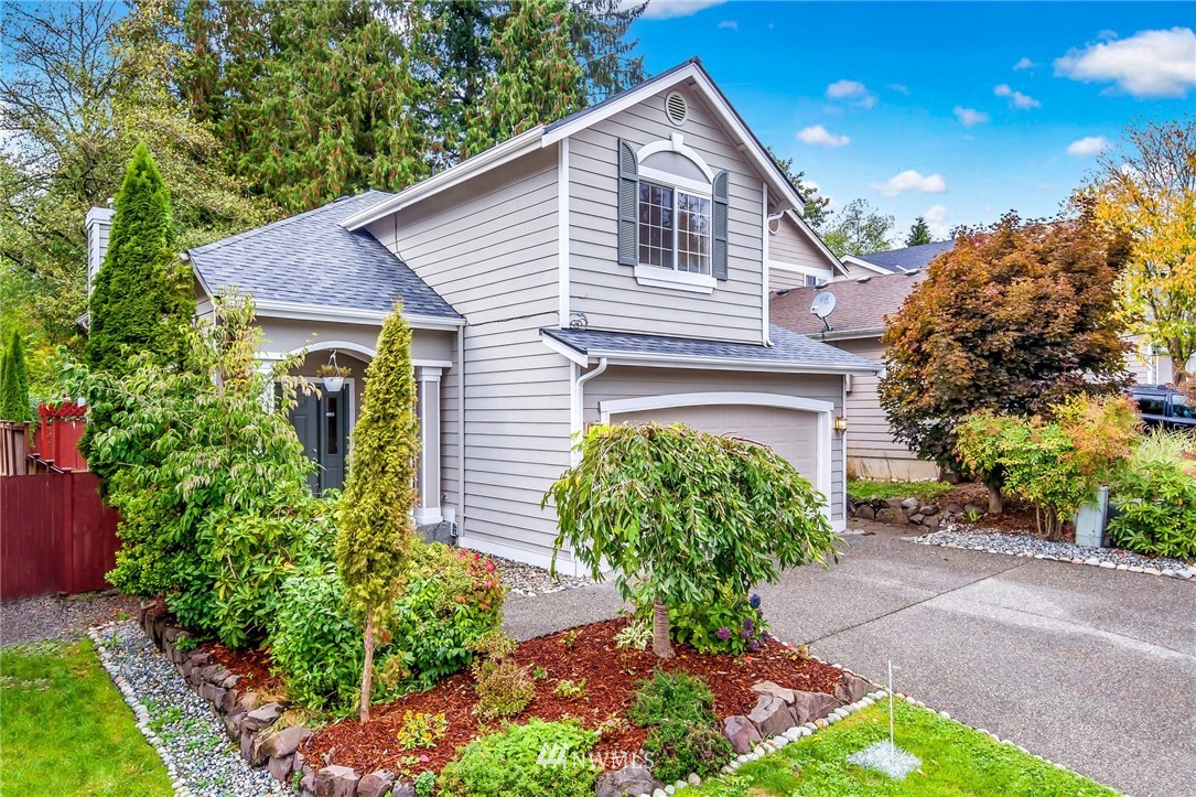 13402 Prospector Ridge Road Southeast Monroe, WA 98272 - Photo 30 of 30 a front view of a house with garden