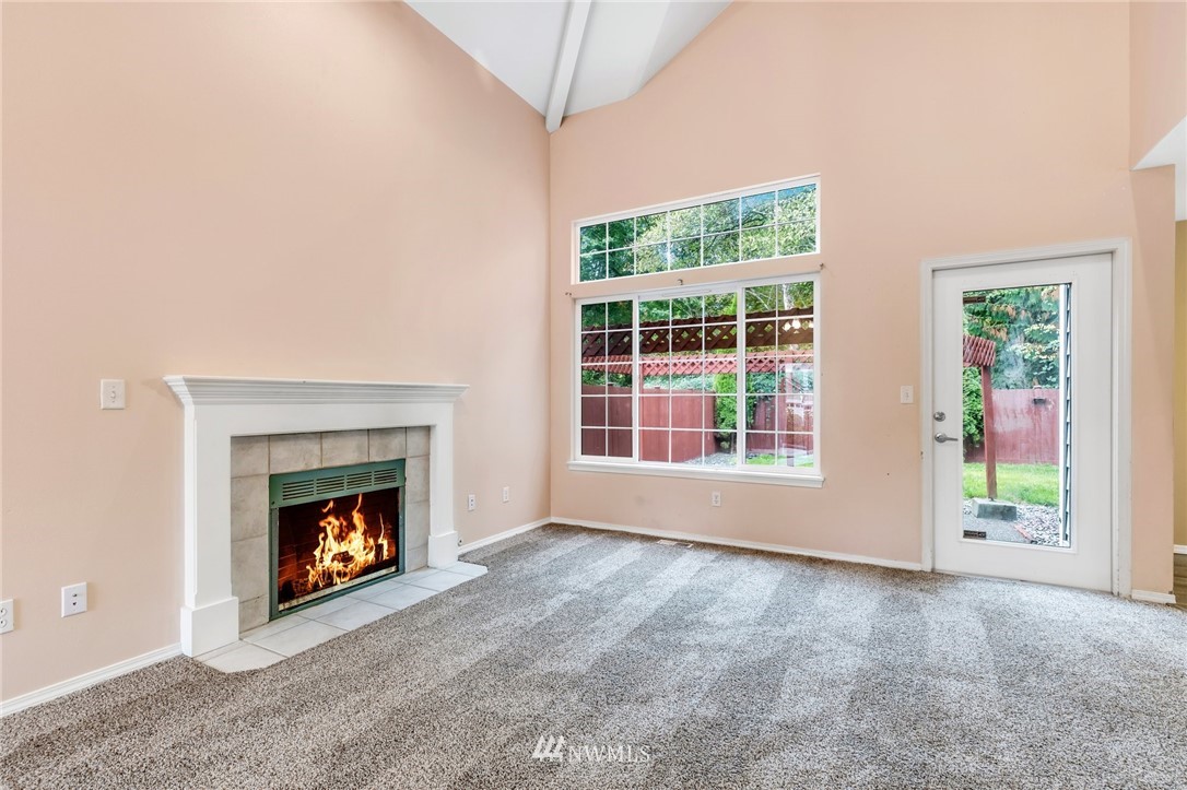 13402 Prospector Ridge Road Southeast Monroe, WA 98272 - Photo 6 of 30 a view of an empty room with window and fire place
