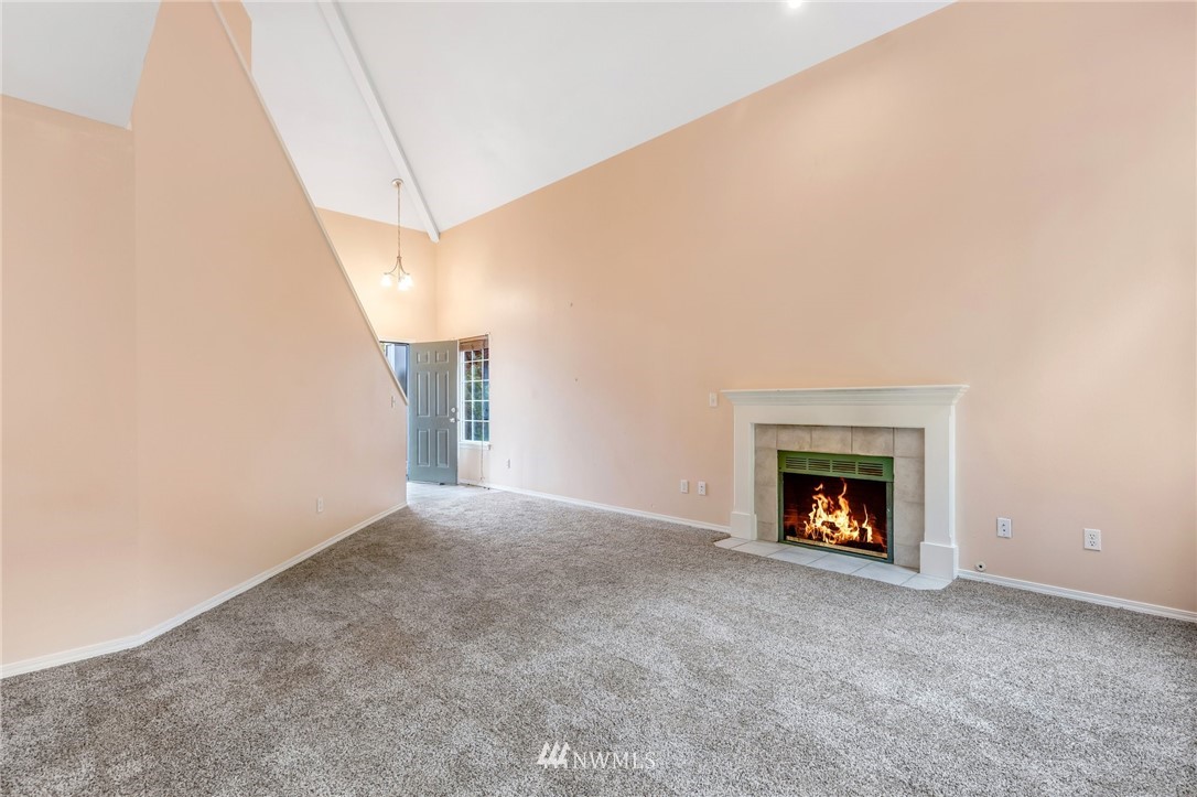 13402 Prospector Ridge Road Southeast Monroe, WA 98272 - Photo 8 of 30 a view of an empty room with a fireplace