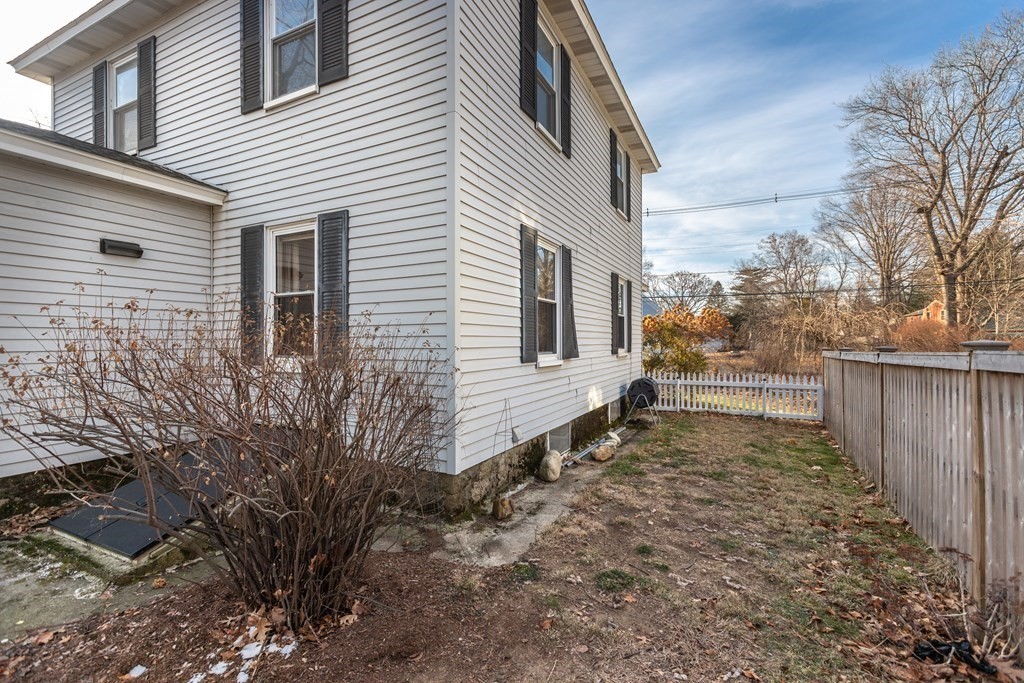 102 Great Road Maynard, MA 01754 - Photo 23 of 32 a view of a yard with wooden fence