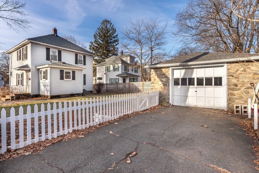 102 Great Road Maynard, MA 01754 - Photo 3 of 32 a front view of a house with a yard
