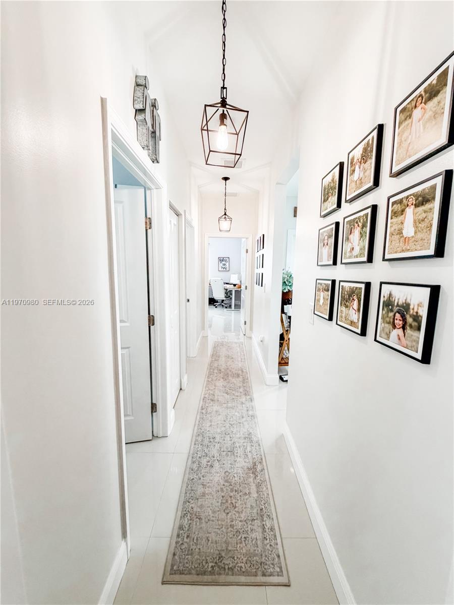 30725 Southwest 158 Path Homestead, FL 33033 - Photo 14 of 29 a picture of a room with wooden floor and windows