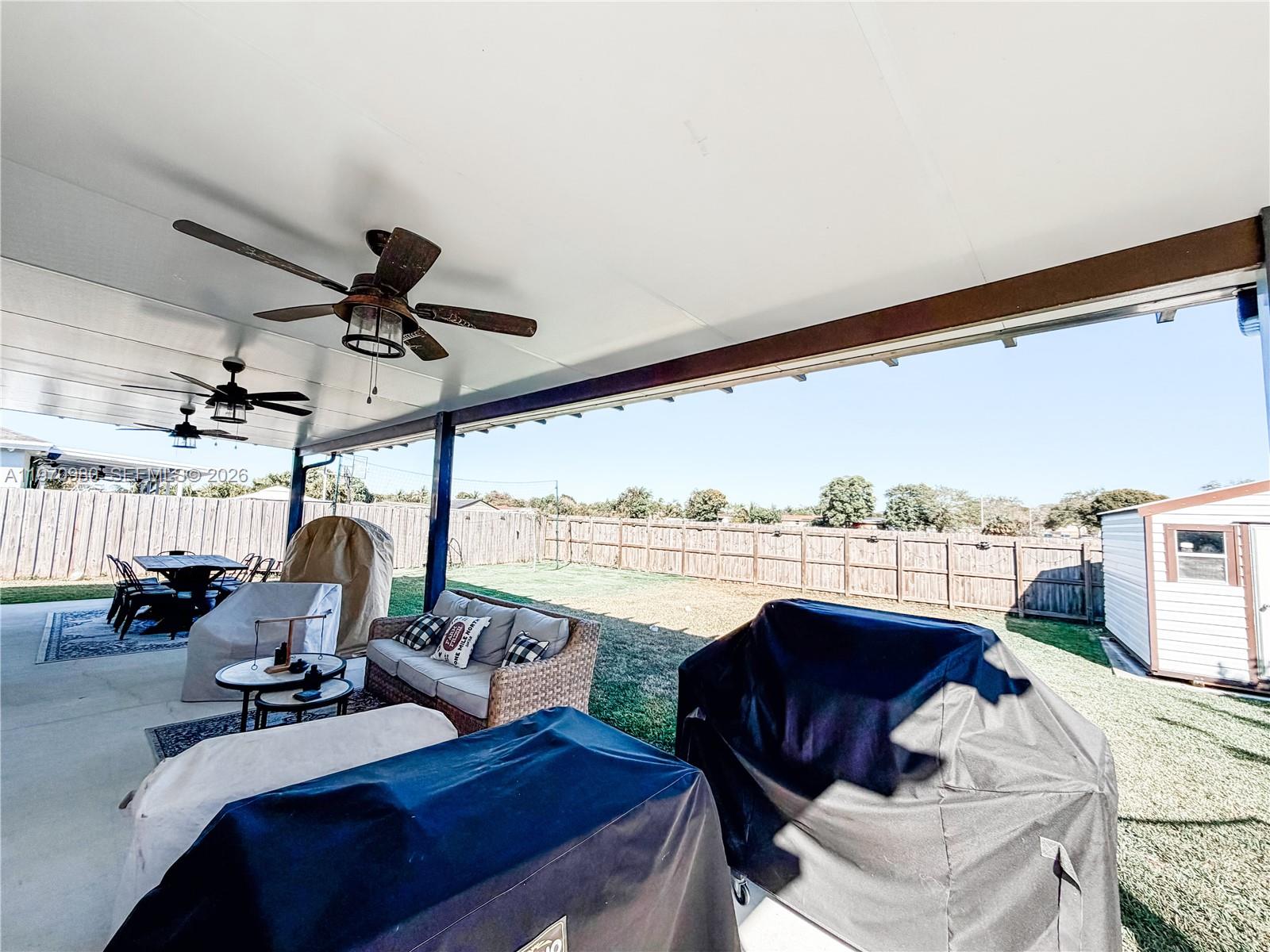 30725 Southwest 158 Path Homestead, FL 33033 - Photo 21 of 29 a view of a livingroom with furniture and a floor to ceiling window