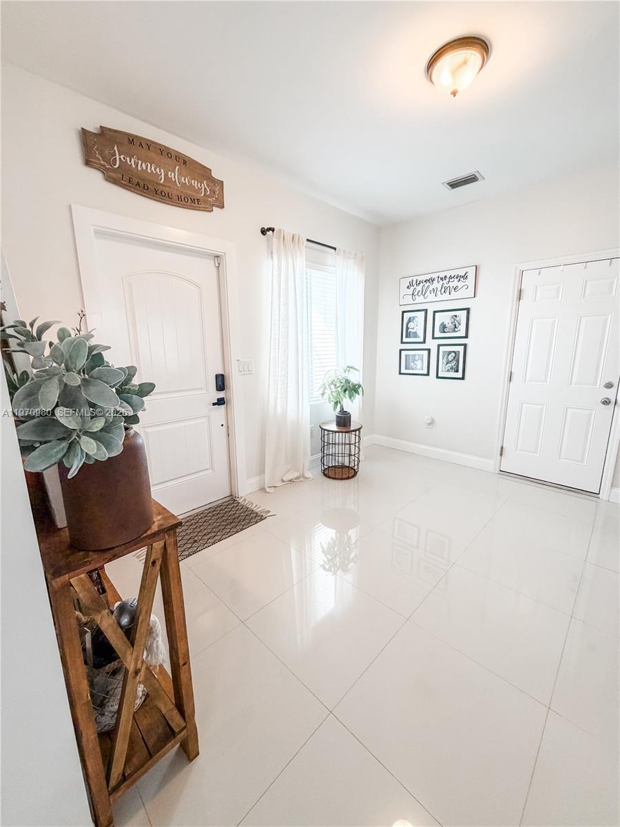 30725 Southwest 158 Path Homestead, FL 33033 - Photo 3 of 29 a view of a livingroom with furniture and a window