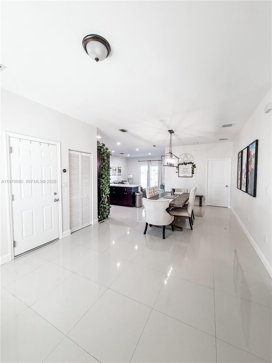 30725 Southwest 158 Path Homestead, FL 33033 - Photo 5 of 29 a living room with furniture and white walls