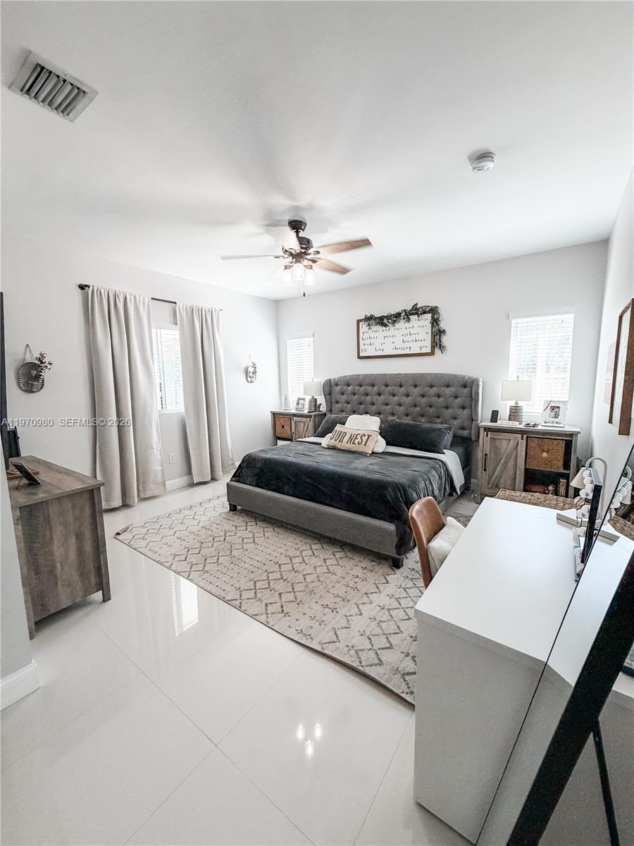 30725 Southwest 158 Path Homestead, FL 33033 - Photo 7 of 29 a living room with furniture and a flat screen tv