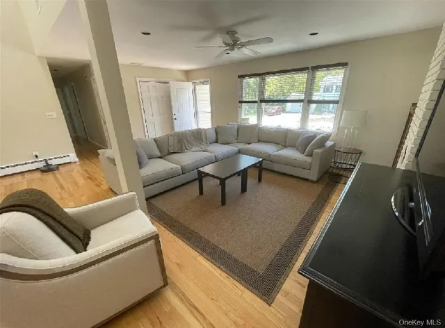 a large kitchen with a table and chairs