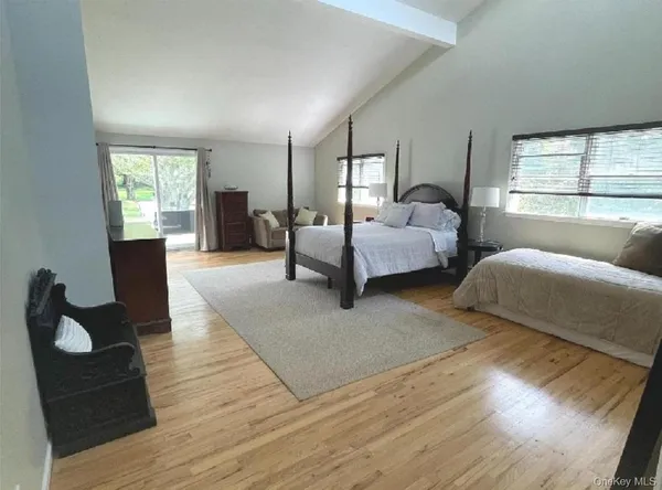 a kitchen with stainless steel appliances granite countertop table chairs sink and cabinets