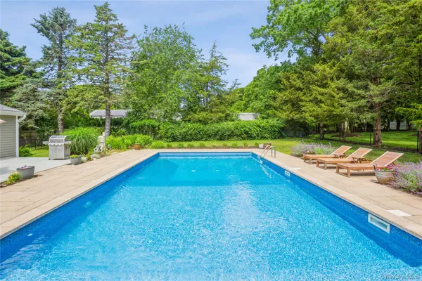 a view of swimming pool with a yard