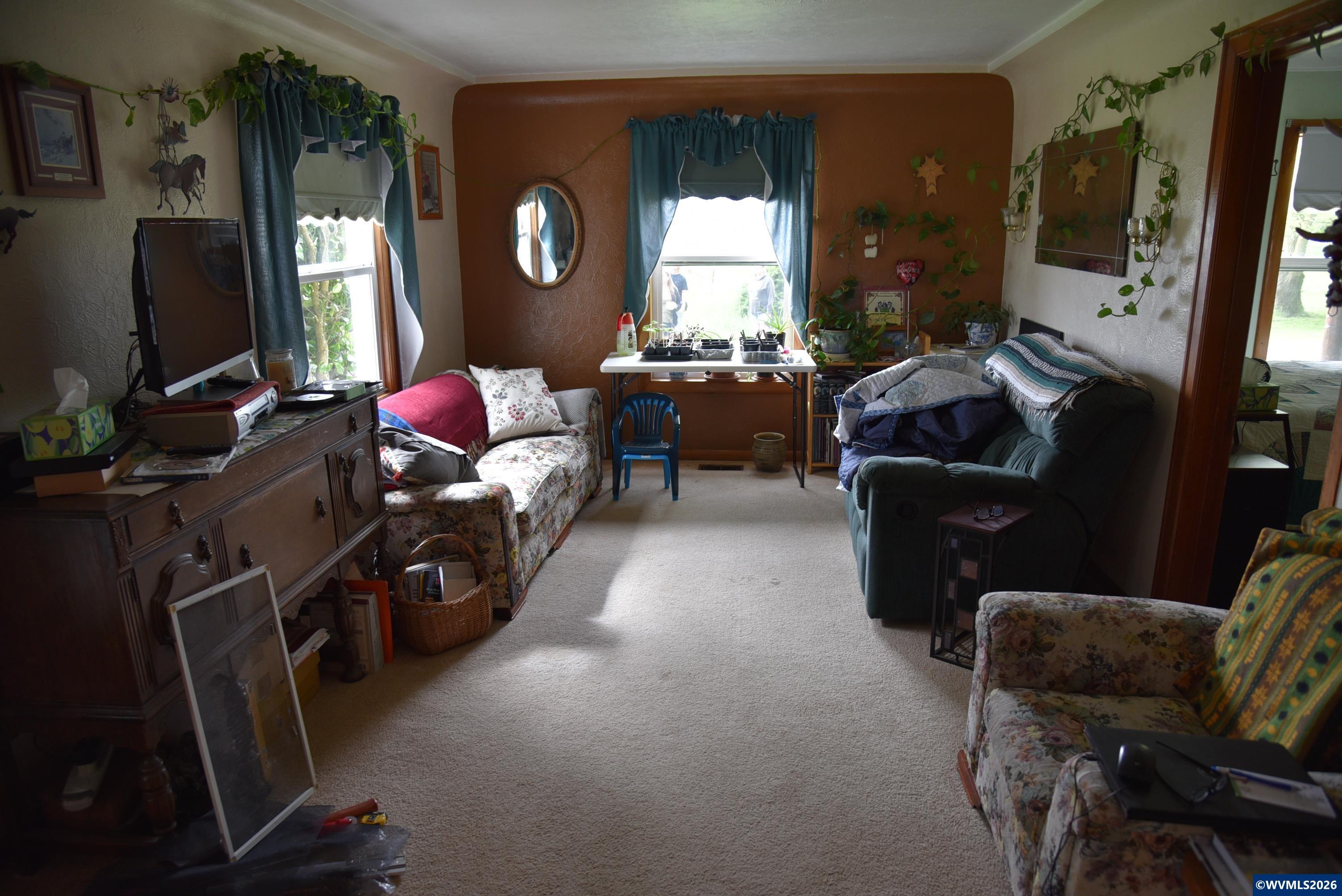 25258 Rowland Road Harrisburg, OR 97446 - Photo 22 of 24 a living room with furniture window and a flat screen tv