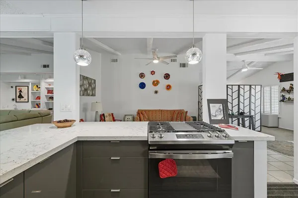 a kitchen with a stove and a sink