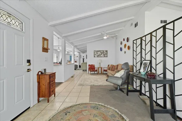 a living room with furniture and a rug