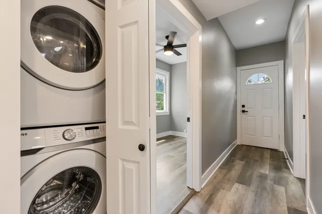 a view of a hallway with washer and dryer