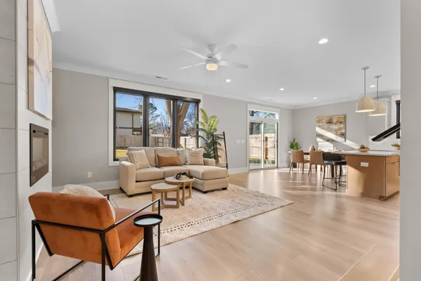 a living room with furniture and a table