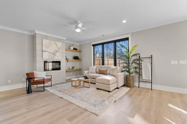 a living room with furniture and a large window