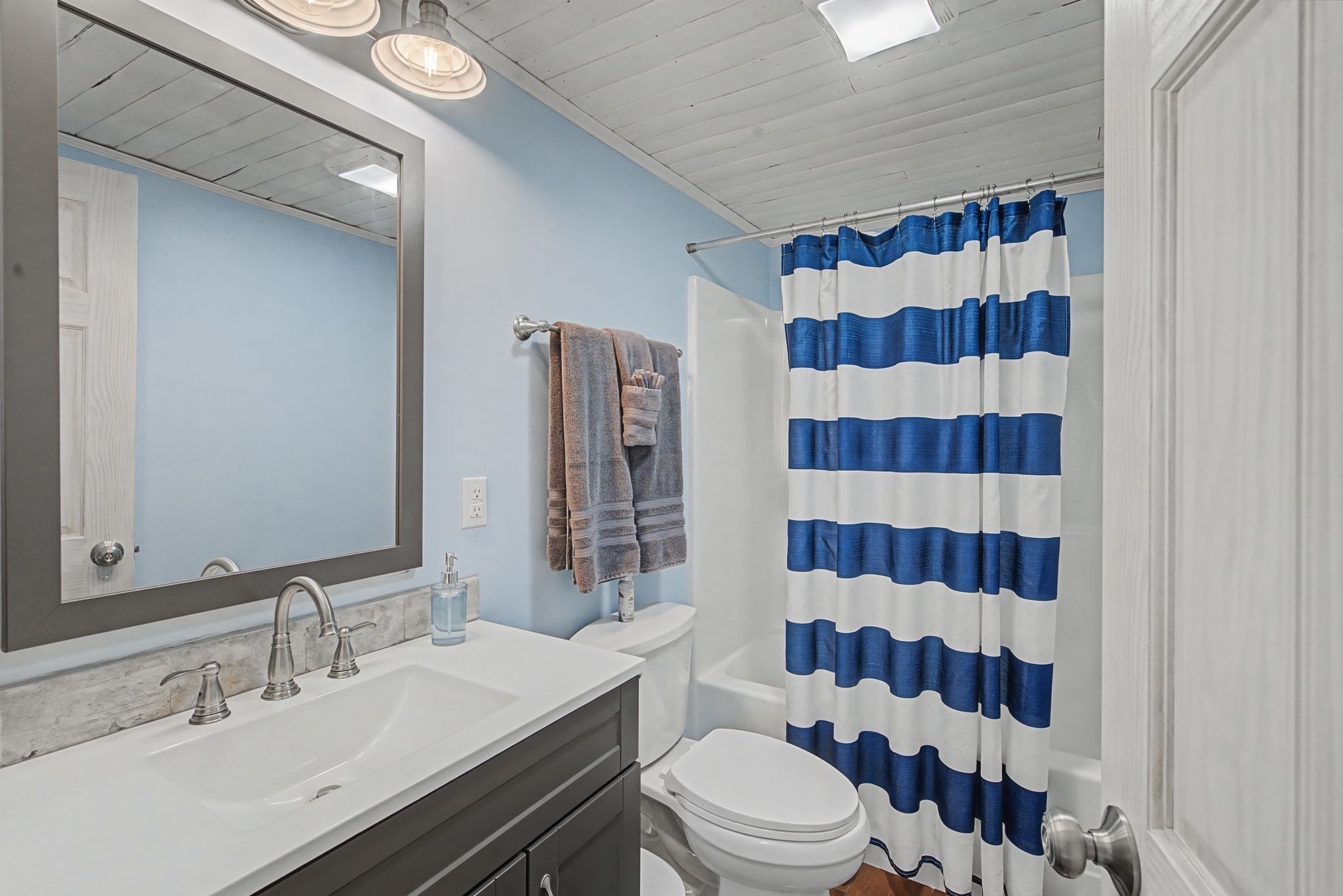 77 Warren Hollow Road Five Points, TN 38457 - Photo 17 of 45 a bathroom with a sink a toilet a shower and a mirror