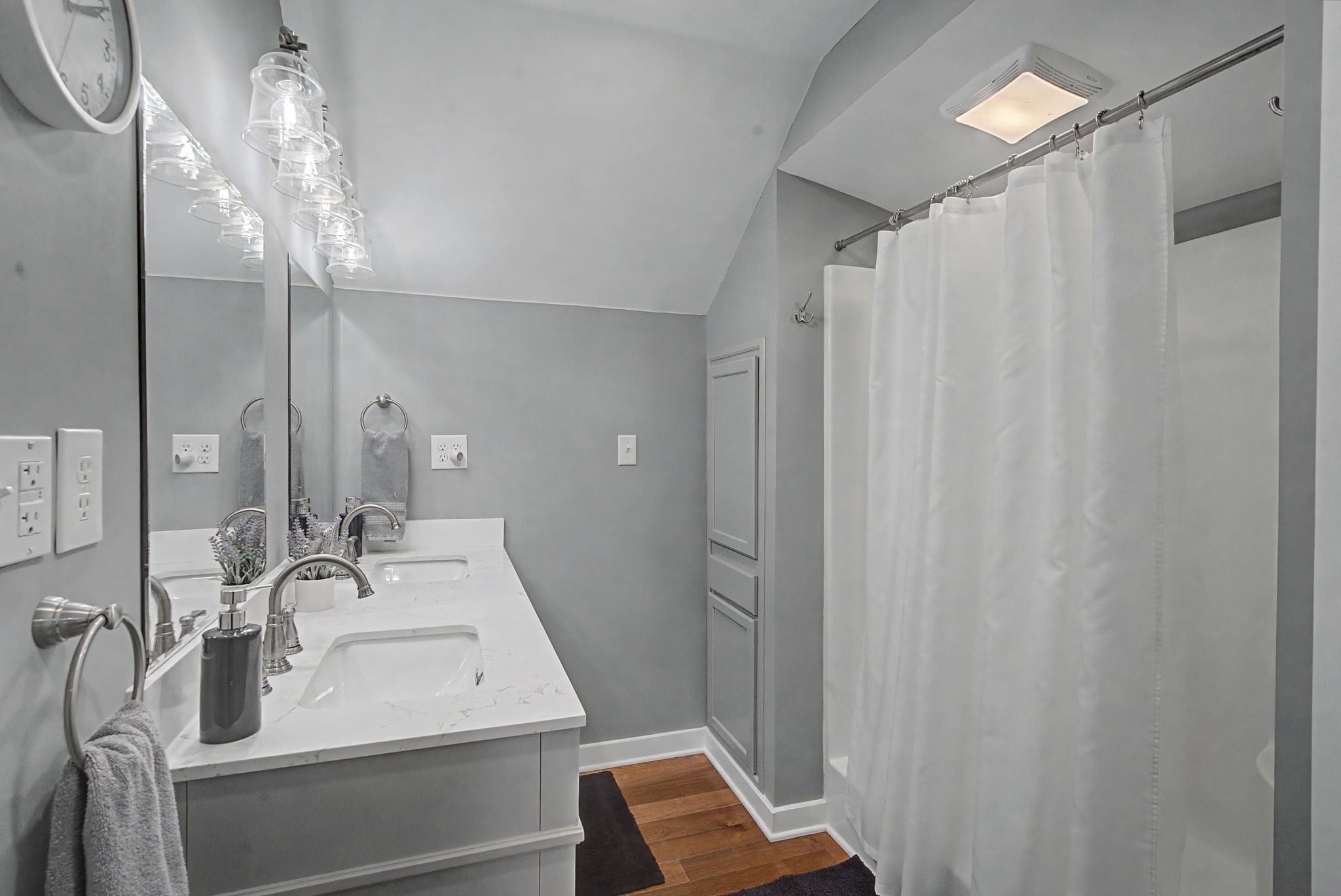 77 Warren Hollow Road Five Points, TN 38457 - Photo 23 of 45 a bathroom with a sink a mirror and a shower curtain