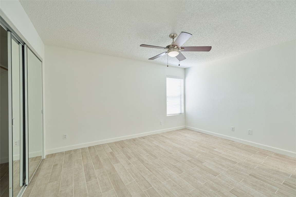 12900 Walden Road, Unit 601F Montgomery, TX 77356 - Photo 16 of 28 an empty room with a window and a fan