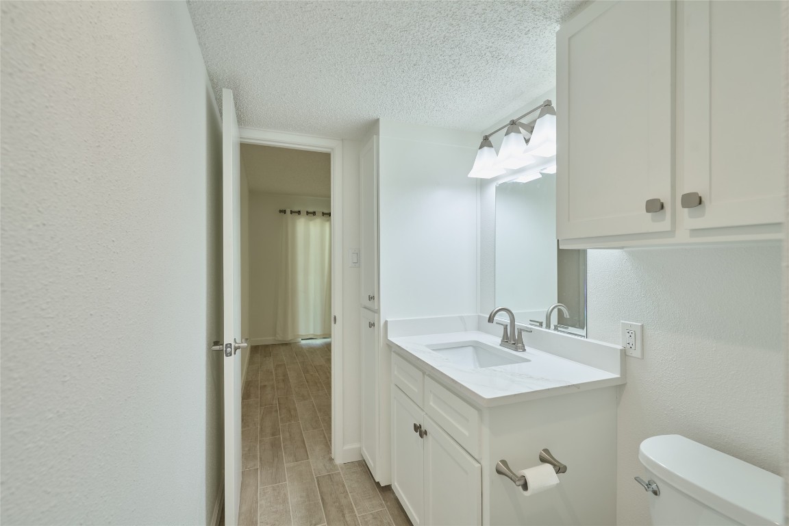 12900 Walden Road, Unit 601F Montgomery, TX 77356 - Photo 21 of 28 a bathroom with a sink a toilet and shower
