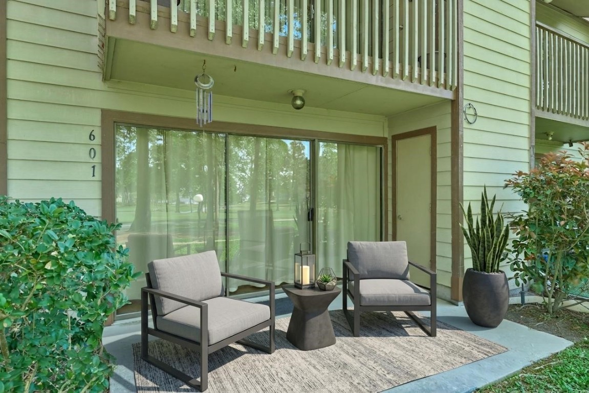 12900 Walden Road, Unit 601F Montgomery, TX 77356 - Photo 25 of 28 a balcony with furniture and potted plants