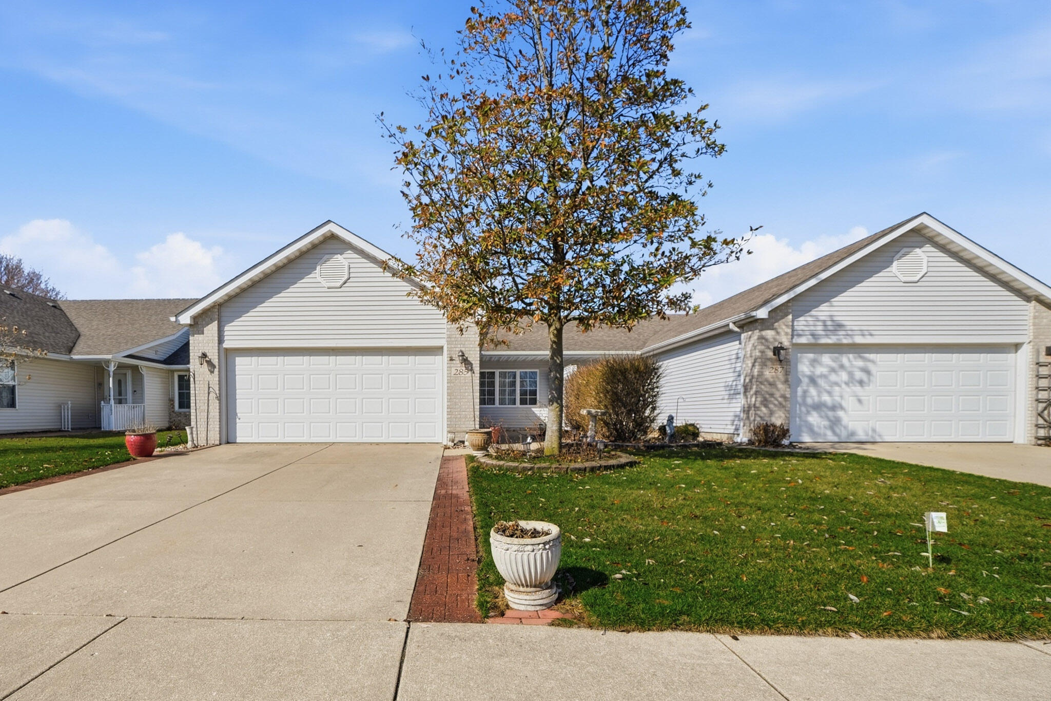 285 North Heather Lane Crown Point, IN 46307 - Photo 1 of 17 a front view of a house with a yard and garage