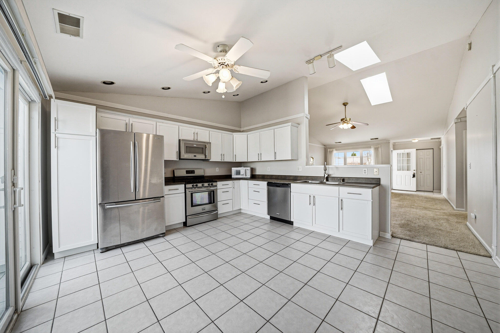 285 North Heather Lane Crown Point, IN 46307 - Photo 11 of 17 a kitchen with stainless steel appliances a refrigerator sink and cabinets