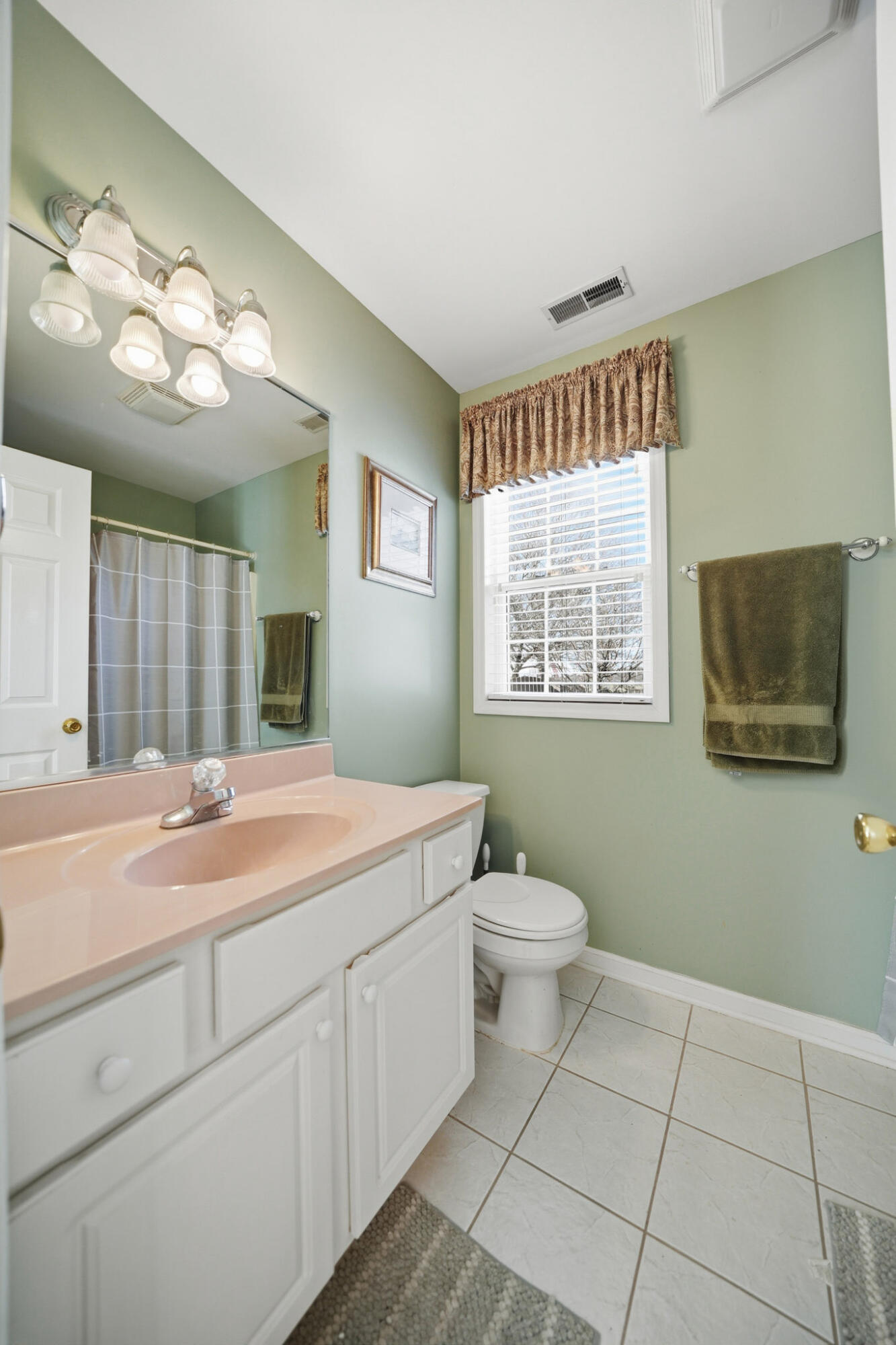 285 North Heather Lane Crown Point, IN 46307 - Photo 7 of 17 a spacious bathroom with a toilet sink and a mirror
