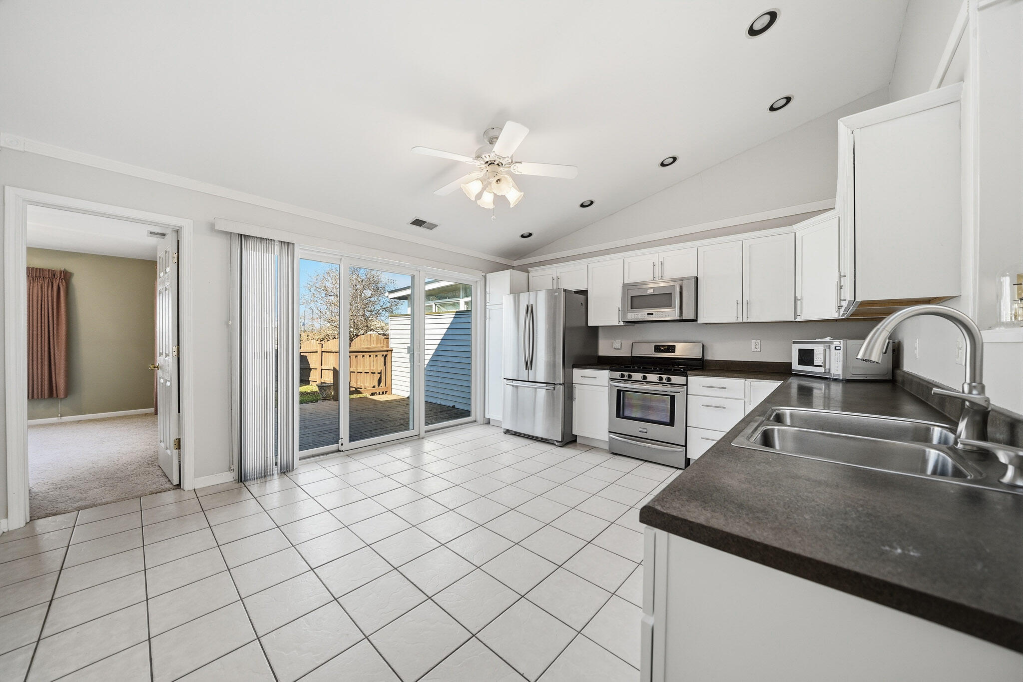 285 North Heather Lane Crown Point, IN 46307 - Photo 10 of 17 a kitchen with stainless steel appliances granite countertop a sink and cabinets