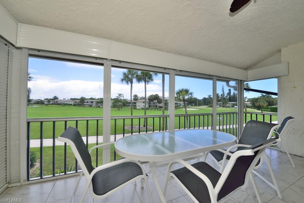 124 Penny Lane, Unit 778 Naples, FL 34112 - Photo 4 of 13 a view of a two chairs in the deck